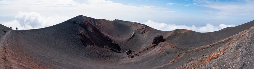 Volcanic crater on Mount Etna, Sicily, above the clouds