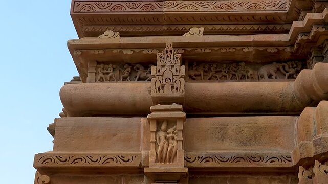 Khajuraho temples captured in a cinematic style, emphasizing their ancient elegance, intricate carvings, and spiritual atmosphere for dramatic visual storytelling. 