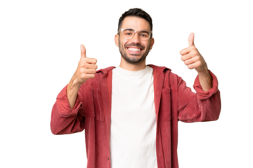 Young handsome caucasian man over isolated chroma key background giving a thumbs up gesture