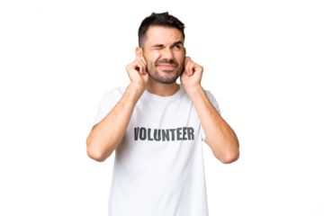 Young volunteer caucasian man over isolated chroma key background frustrated and covering ears