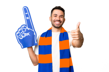 Young caucasian sports fan man over isolated chroma key background with thumbs up because something good has happened