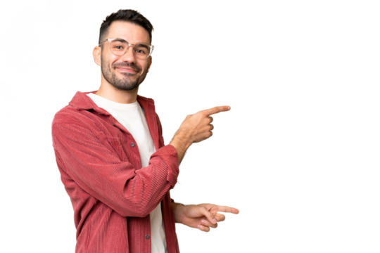 Young handsome caucasian man over isolated chroma key background pointing finger to the side and presenting a product