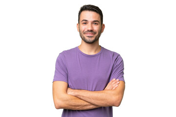 Young handsome caucasian man over isolated background keeping the arms crossed in frontal position