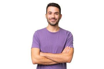 Young handsome caucasian man over isolated background keeping the arms crossed in frontal position