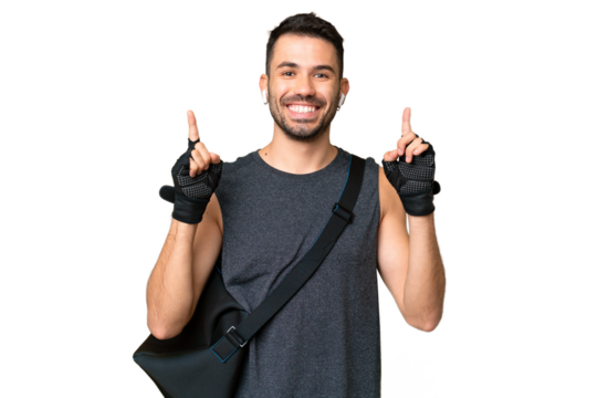 Young sport caucasian man with sport bag over over isolated chroma key background pointing up a great idea