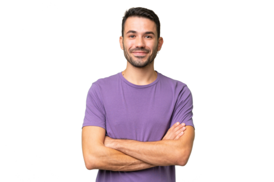 Young handsome caucasian man over isolated background keeping the arms crossed in frontal position
