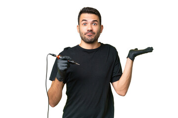 Tattoo artist caucasian man over isolated background having doubts while raising hands