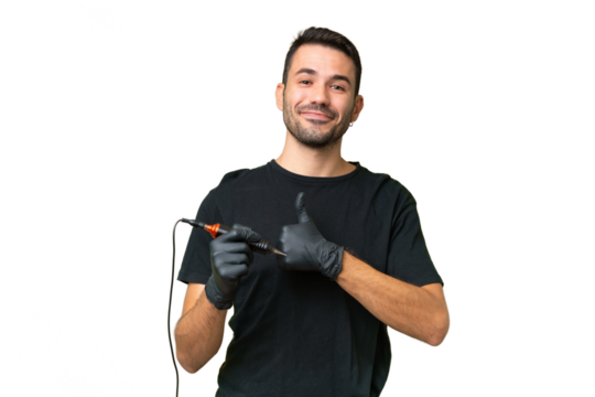 Tattoo artist caucasian man over isolated background giving a thumbs up gesture
