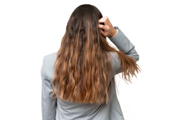 Young caucasian woman over isolated chroma key background in back position and thinking