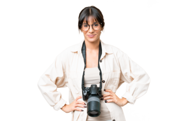 Young photographer caucasian woman over isolated chroma key background posing with arms at hip and smiling