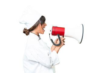 Young caucasian chef woman over isolated chroma key background shouting through a megaphone