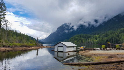 Dramatic Landscape of Buntzen Lake with Pine Forests and Rain Clouds