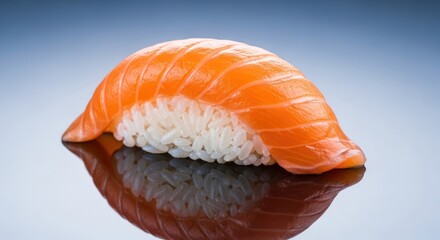 A close-up of a fresh salmon nigiri sushi placed on a glossy reflective surface against a gradient background. The image showcases the vibrant orange color and delicate texture of the salmon 