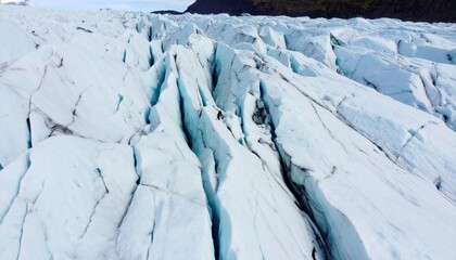 Aerial View of Glacier Crevasses: Turquoise Ice Grid Pattern