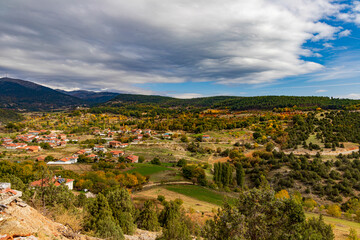 Obraz premium Village Landscape with Wind Mountain View