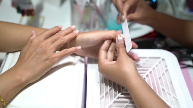 Professional Nail Care and Manicure Process with Focus on Hands and Tools in Beauty Salon Setting for Personal Grooming and Self-Care