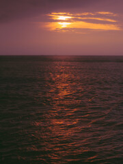 Fototapeta premium Sunset reflection on calm ocean surface