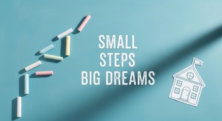 Text Saying Small Steps Big Dreams on a Blue Background