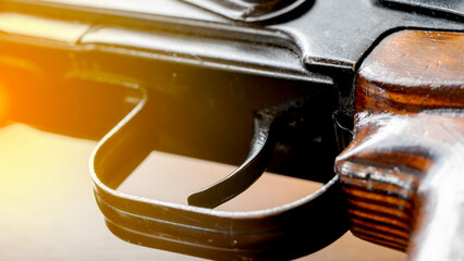 Kalashnikov assault rifle on a wooden background