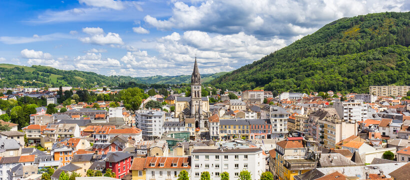 Panoramic view over the historic city center and surrounding landsape of Lourdes, France