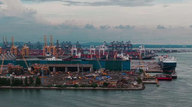Aerial view shipping port boat with crane transport industry