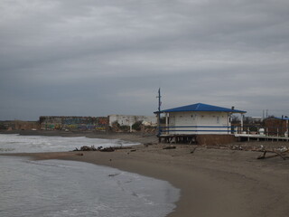 beach huts at sunset