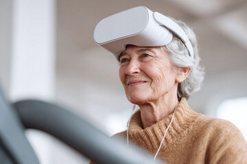 Senior woman exploring virtual reality with a headset, smiling. Concept technology adoption, learning, experience, future. Great for articles, ads about tech  aging.