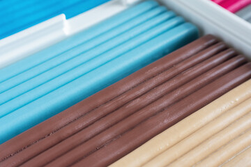 Multi-colored plasticine in a box, for artistic modeling and development of children's creativity