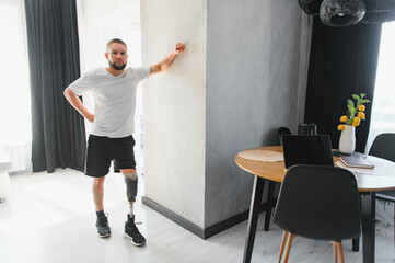 Man amputee with prosthetic leg disability on above knee transfemoral leg prosthesis artificial...