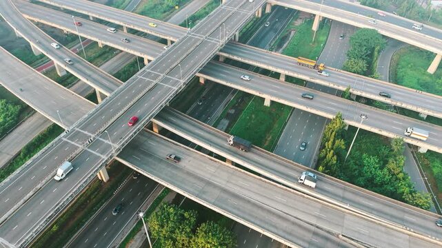 Aerial view city transport junction road morning light with vehicle movement transport industry
