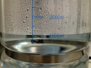 Close-up of a beaker with water droplets