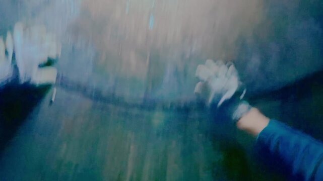 The guy is at the bottom of a well with water and is trying to get out of it. The frightened man in the pit. Risk to life. From the first person.