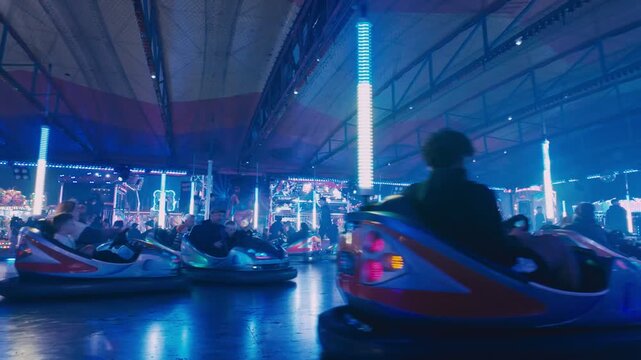 Dodgems, bumper cars. Hull fair, fairground ride. Neon lights, lasers.