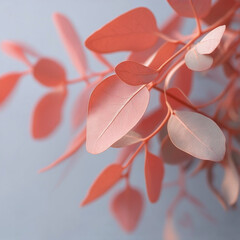 自然光に揺れるコーラルピンクの葉のソフトなモーションブラー背景