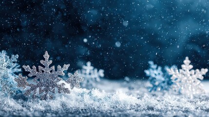 Obraz premium Delicate Close Up of Sparkling Snowflakes Falling Against a Dark Blue Background