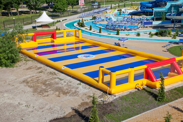 Zolotaya Bukhta water park. Gelendzhik. A large inflatable soccer field with a red goal