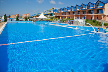 Gelendzhik resort. Zolotaya Bukhta water park. A large swimming pool with a white tent in the background