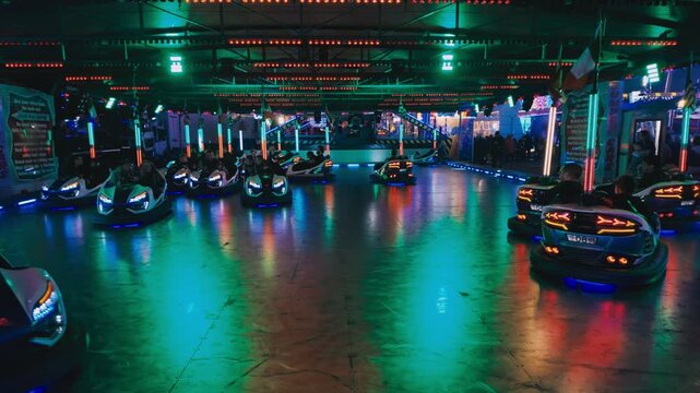 Dodgems, bumper cars. Hull fair, fairground ride. Neon lights, lasers.