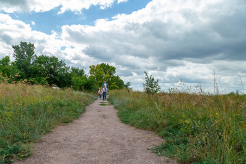 Father and children have fun, laugh and enjoy nature outdoors.