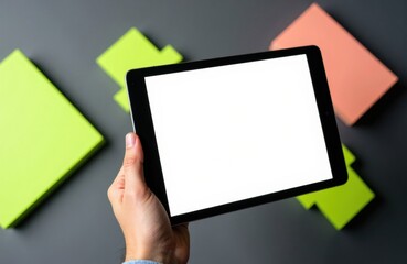 Woman holding digital tablet with blank screen among colorful sticky notes on dark background