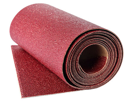 Rolled-up Sheet of Red Sandpaper Isolated on White, for woodworking and finishing