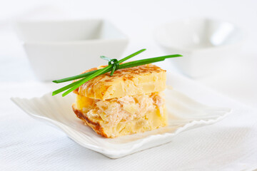 Potato omelet skewer filled with fish sauce.