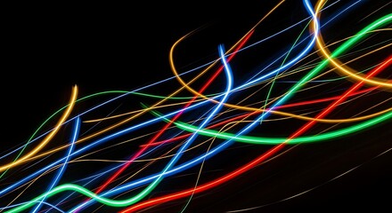 Abstract light painting with colorful trails on a black background, creating a dynamic and mesmerizing visual effect