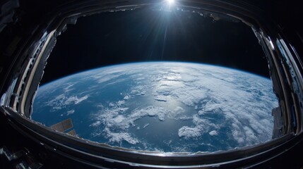 Fototapeta premium Bright sunlight illuminates Earth showcasing vibrant oceans and soft white clouds from space.
