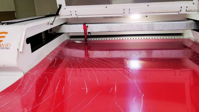 red plexiglass cut on a laser cutting machine