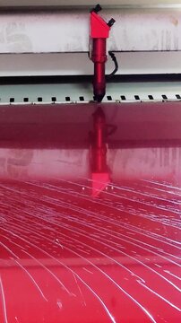 red plexiglass cut on a laser cutting machine