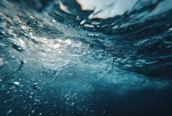Dynamic water splash with bubbles and motion in deep blue tones