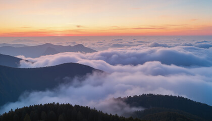Fototapeta premium Aerial view of mountains and clouds during sunset with colorful sky 