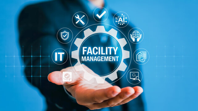 Businessman displaying facility management icons with gear graphic