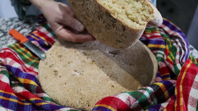 Traditional Moroccan seeded khobz &mdash; homemade round bread with anise, pumpkin and mixed seeds, rustic close-up video